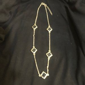 the clover” in black and gold